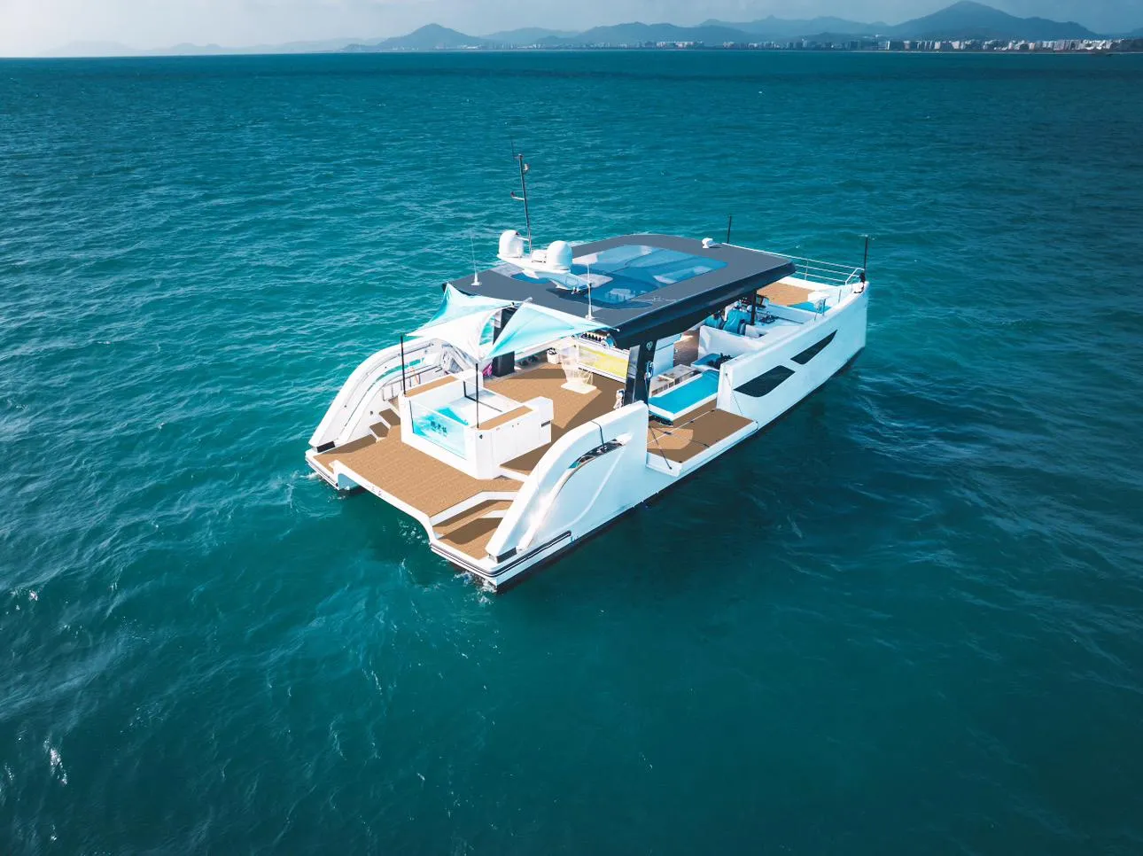 2024 Diamond Yachts P55 Power Catamaran cruising on open water.