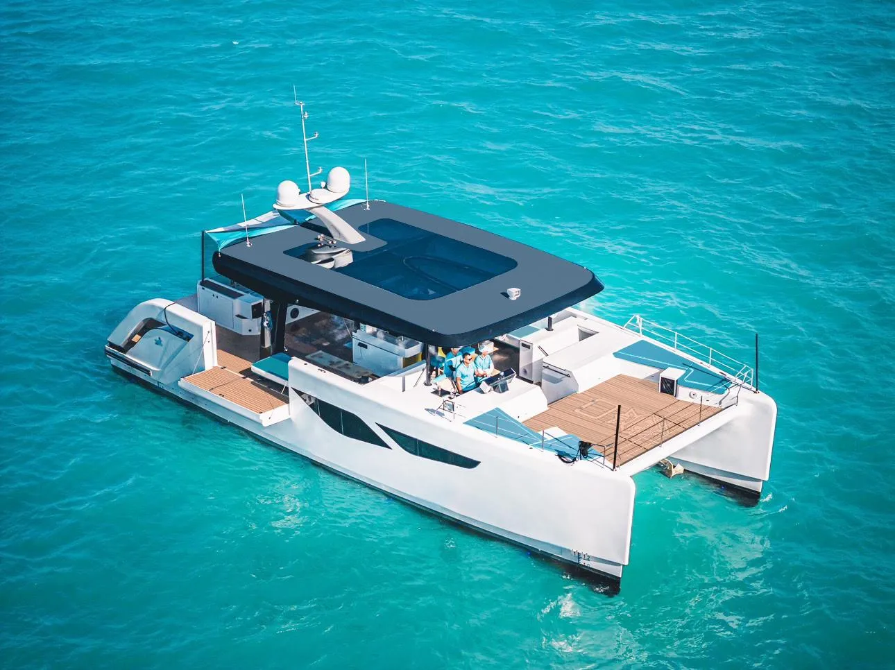 2024 Diamond Yachts P55 Power Catamaran cruising on clear blue water.