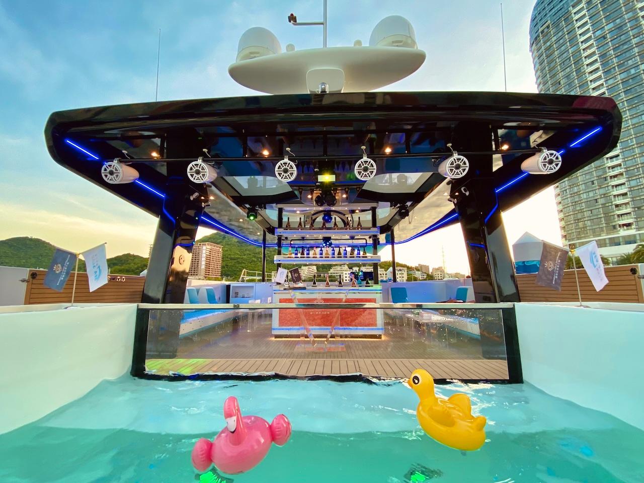 2024 Catamaran Diamond Yachts P55 Power Catamaran with pool and cityscape backdrop.