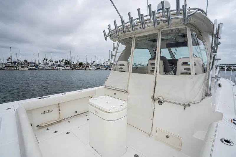 Luna Dei Pescatori Yacht Photos Pics 2009 Boston Whaler 345 Conquest boat docked in marina, overcast sky, spacious deck area.