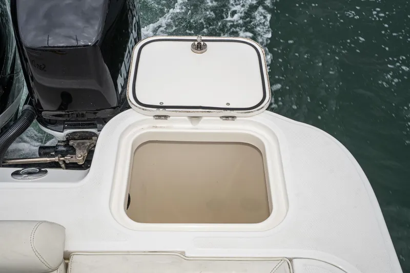 Luna Dei Pescatori Yacht Photos Pics Open storage compartment on 2009 Boston Whaler 345 Conquest boat, near water.