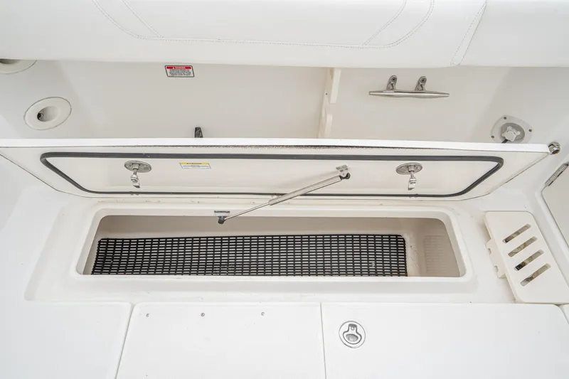 Luna Dei Pescatori Yacht Photos Pics 2009 Boston Whaler 345 Conquest storage compartment with open lid and interior view.