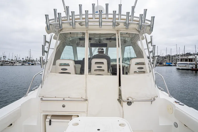 Luna Dei Pescatori Yacht Photos Pics 2009 Boston Whaler 345 Conquest boat docked in marina, rear view with fishing rod holders.