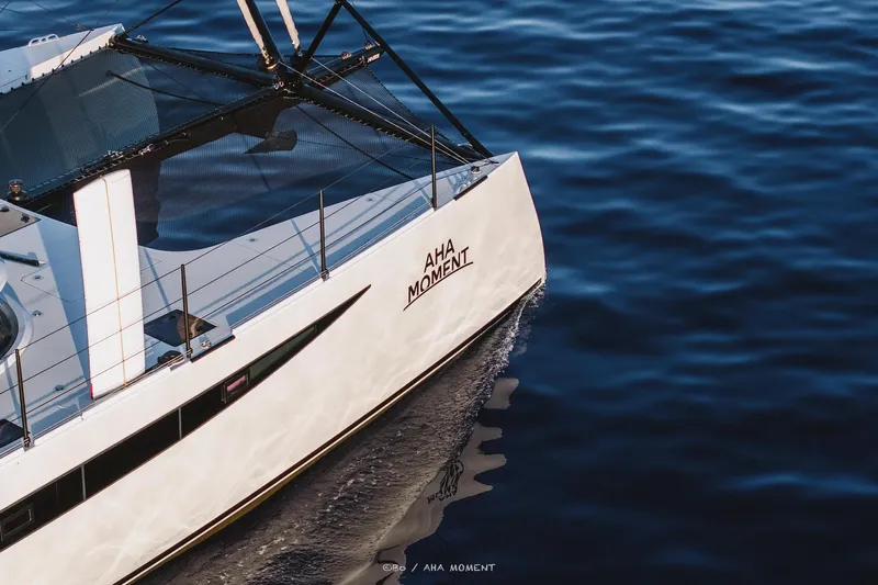  Yacht Photos Pics 2022 HH Catamarans HH55 sailing on calm blue waters.