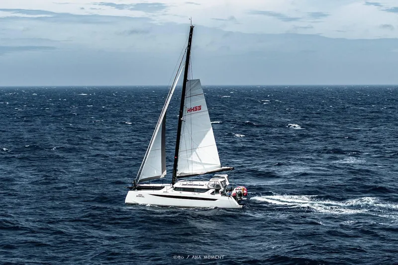  Yacht Photos Pics 2022 HH Catamarans HH55 sailing on open ocean under cloudy sky.