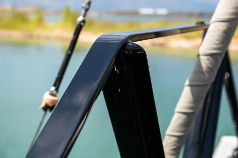  Yacht Photos Pics Close-up of 2022 HH Catamarans HH55 railing detail by the water.