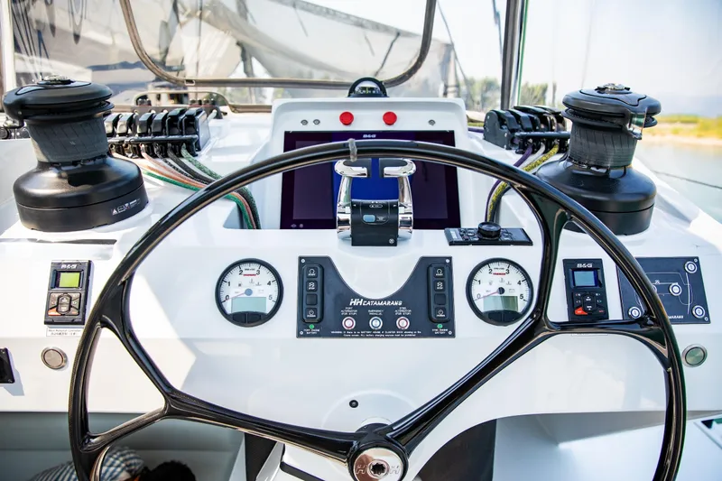  Yacht Photos Pics Helm of 2022 HH Catamarans HH55, featuring modern navigation instruments and controls.