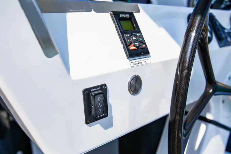  Yacht Photos Pics Helm controls of 2022 HH Catamarans HH55, featuring windlass switch and navigation system.