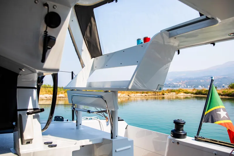  Yacht Photos Pics Modern HH Catamarans HH55 cockpit with scenic water view, 2022 model.