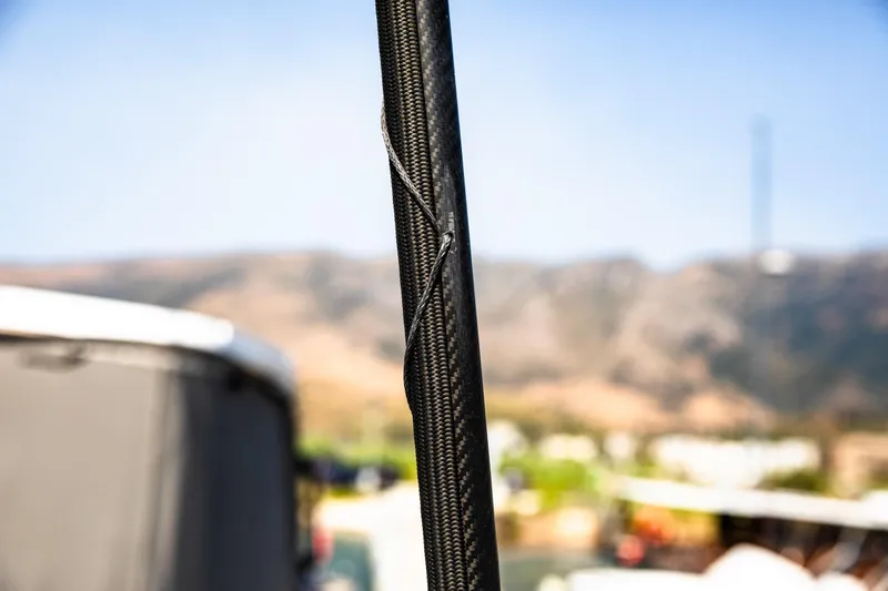  Yacht Photos Pics Close-up of HH Catamarans HH55 mast, 2022 model, with blurred background.