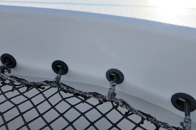  Yacht Photos Pics Close-up of HH55 catamaran's netting and hull detail, 2022 model.