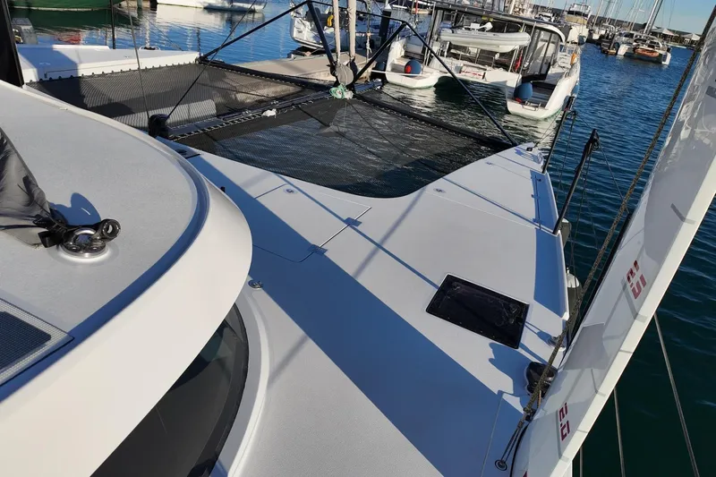  Yacht Photos Pics 2022 HH Catamarans HH55 docked, showcasing sleek deck design and marina setting.