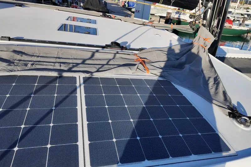  Yacht Photos Pics 2022 HH Catamarans HH55 with solar panels on deck, docked at marina.