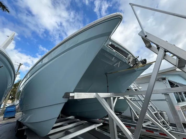 Pcm 51799 400dcis Yacht Photos Pics 2025 World Cat 400 DC-IS boat on trailer under blue sky.