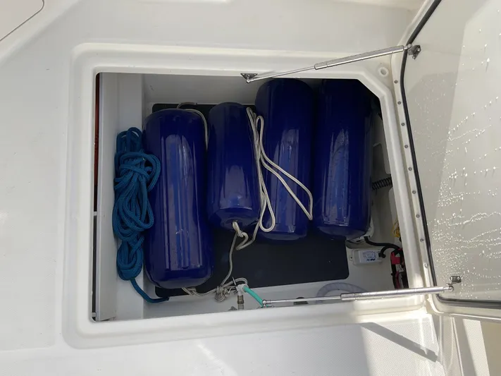 Pcm 51799 400dcis Yacht Photos Pics Storage compartment with blue fenders and rope on a 2025 World Cat 400 DC-IS boat.