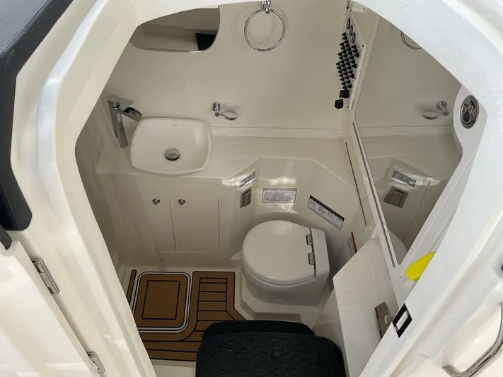 Pcm 51799 400dcis Yacht Photos Pics 2025 World Cat 400 DC-IS boat bathroom with sink, toilet, and mirror.