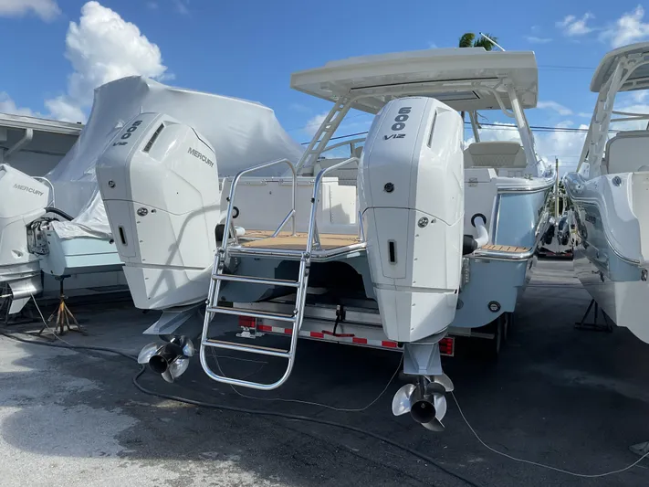 Pcm 51799 400dcis Yacht Photos Pics 2025 World Cat 400 DC-IS boat with twin outboard engines on a trailer.