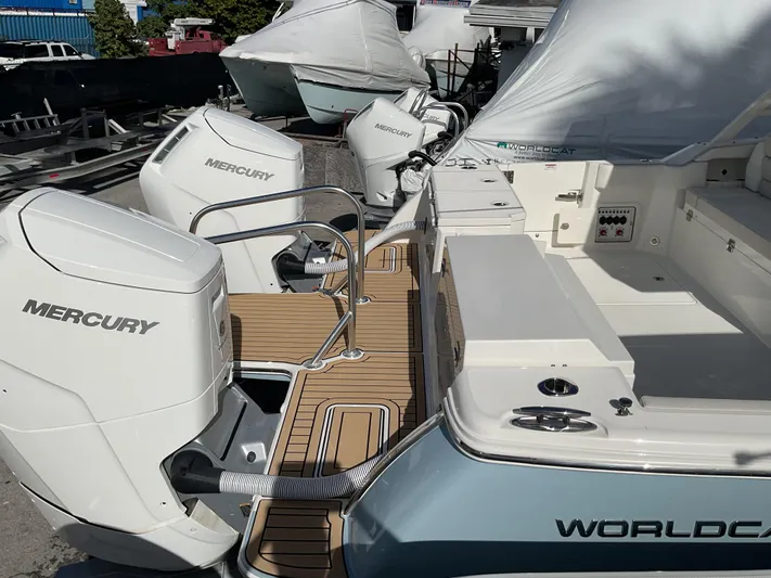 Pcm 51799 400dcis Yacht Photos Pics 2025 World Cat 400 DC-IS boat with Mercury engines, docked and covered.