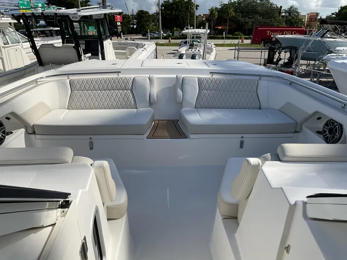 Pcm 51799 400dcis Yacht Photos Pics Luxurious seating area on 2025 World Cat 400 DC-IS boat, featuring elegant white upholstery.