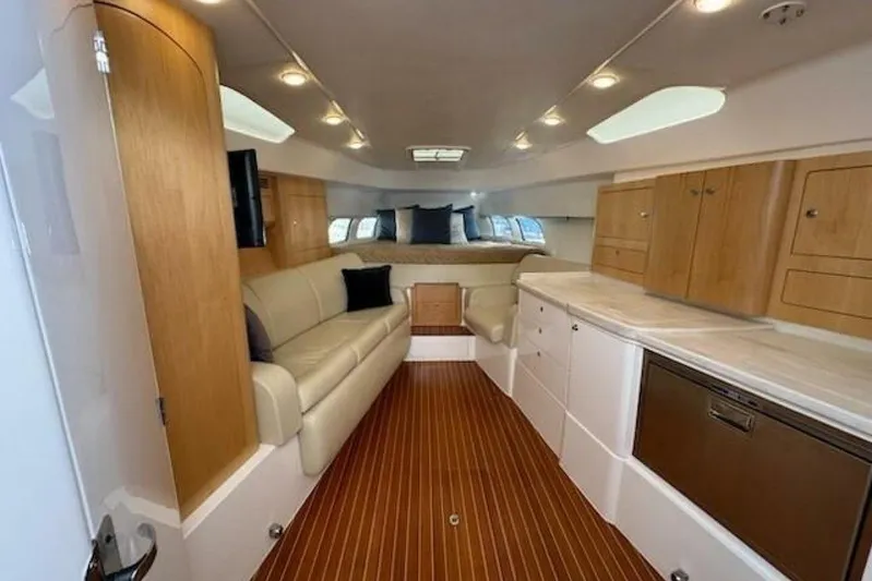 Saga Yacht Photos Pics Luxurious interior of 2019 Intrepid 430 Sport Yacht with wood accents and modern amenities.