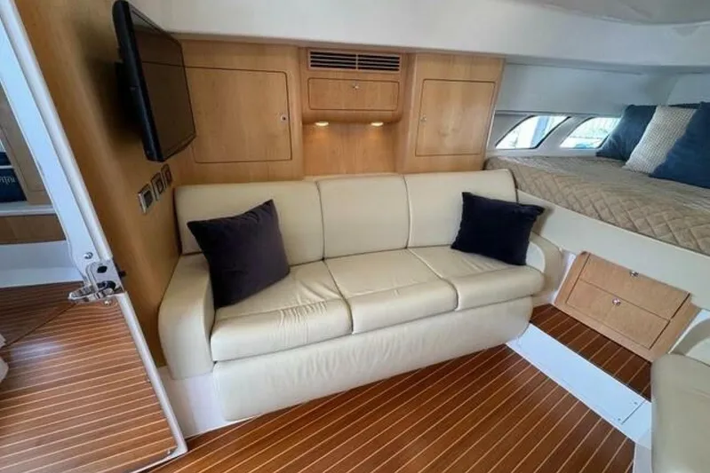 Saga Yacht Photos Pics Luxurious interior of 2019 Intrepid 430 Sport Yacht with sofa and bed.