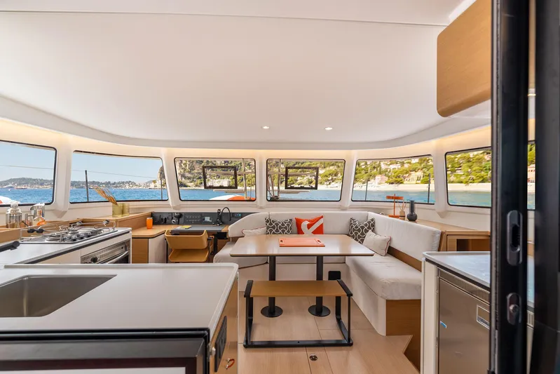  Yacht Photos Pics Luxurious interior of 2026 Excess 13 yacht with panoramic windows and modern furnishings.