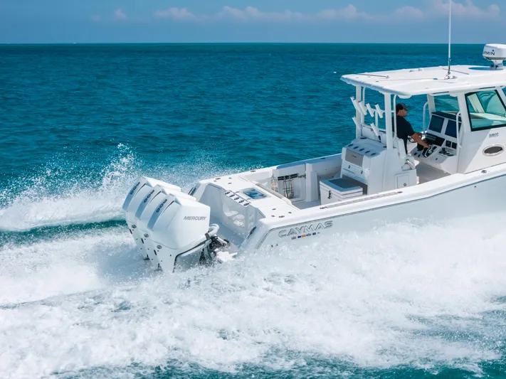  Yacht Photos Pics 2023 Caymas 341 CC boat cruising on open ocean waters.