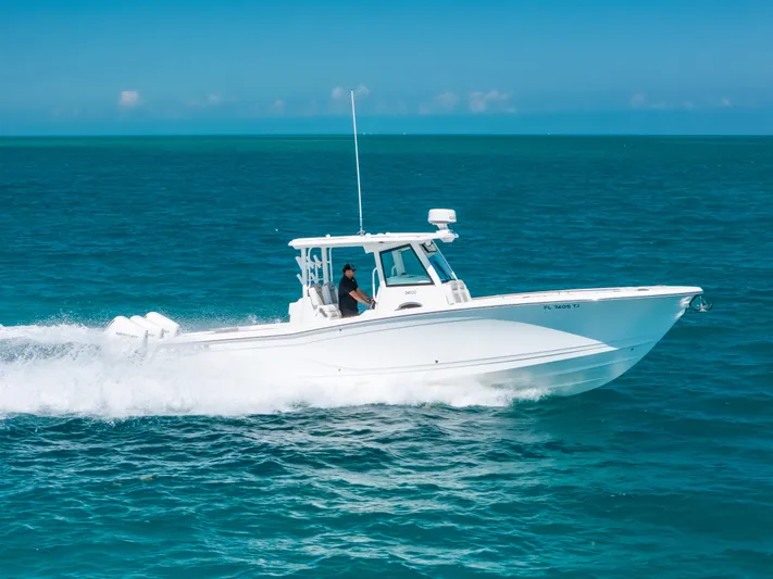  Yacht Photos Pics 2023 Caymas 341 CC boat cruising on open ocean waters.