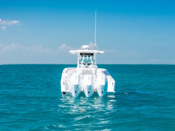  Yacht Photos Pics 2023 Caymas 341 CC boat on clear blue ocean water.