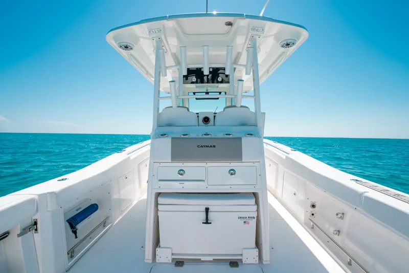  Yacht Photos Pics 2023 Caymas 341 CC boat on open sea, featuring sleek design and spacious deck.
