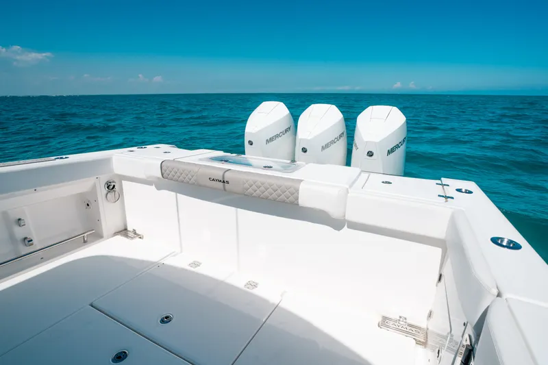  Yacht Photos Pics 2023 Caymas 341 CC boat with triple outboard motors on open sea.