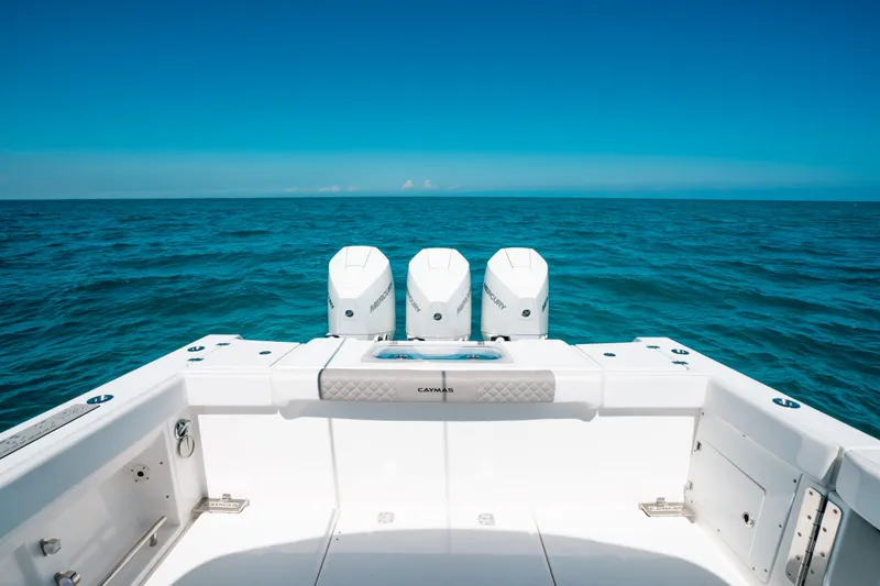  Yacht Photos Pics 2023 Caymas 341 CC boat with triple engines on open ocean.