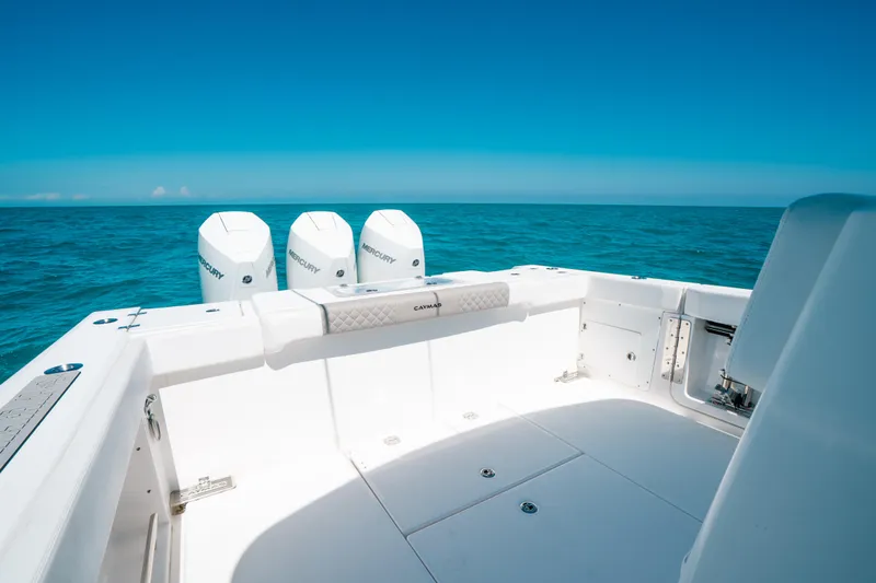  Yacht Photos Pics 2023 Caymas 341 CC boat with triple engines on open sea.