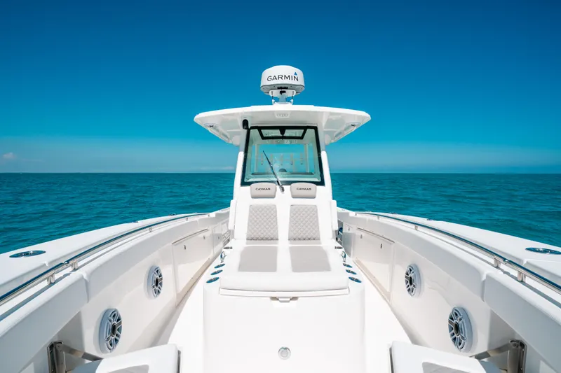  Yacht Photos Pics 2023 Caymas 341 CC boat on open sea under clear blue sky.