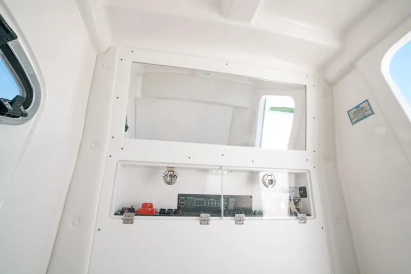  Yacht Photos Pics 2023 Caymas 341 CC interior cabin with control panel and window.