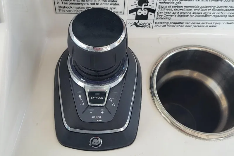  Yacht Photos Pics 2023 Caymas 341 CC boat control panel with joystick and cup holder.