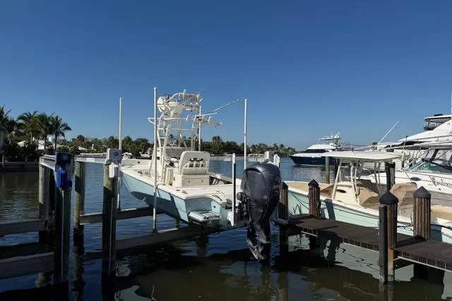  Yacht Photos Pics 2023 Pathfinder 2600 TRS boat docked at marina under clear blue sky.
