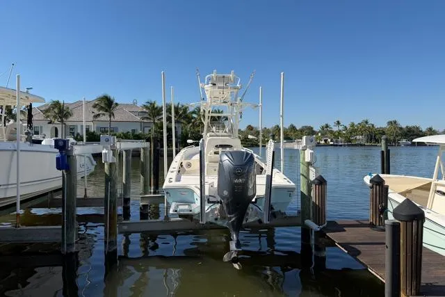  Yacht Photos Pics 2023 Pathfinder 2600 TRS boat docked at marina with Yamaha outboard motor.