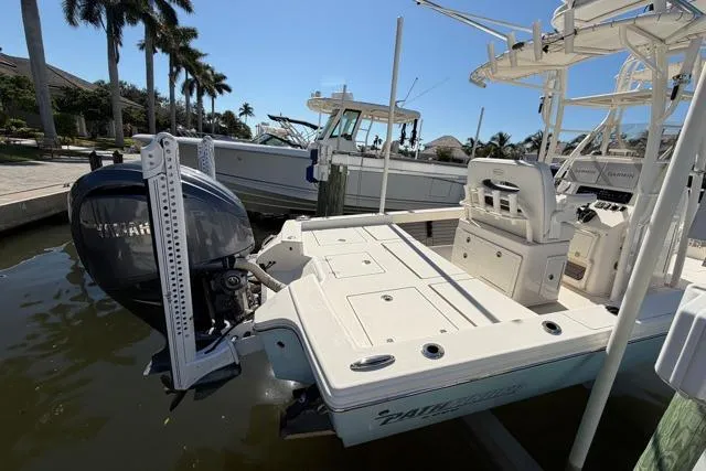  Yacht Photos Pics 2023 Pathfinder 2600 TRS boat docked, featuring Yamaha outboard motor, palm trees in background.