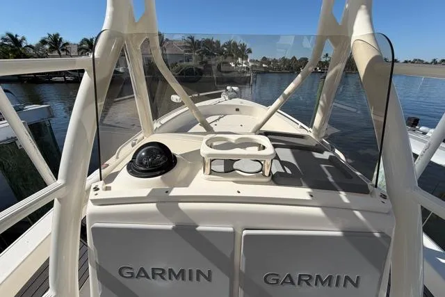  Yacht Photos Pics 2023 Pathfinder 2600 TRS boat with Garmin equipment, docked by a scenic waterfront.