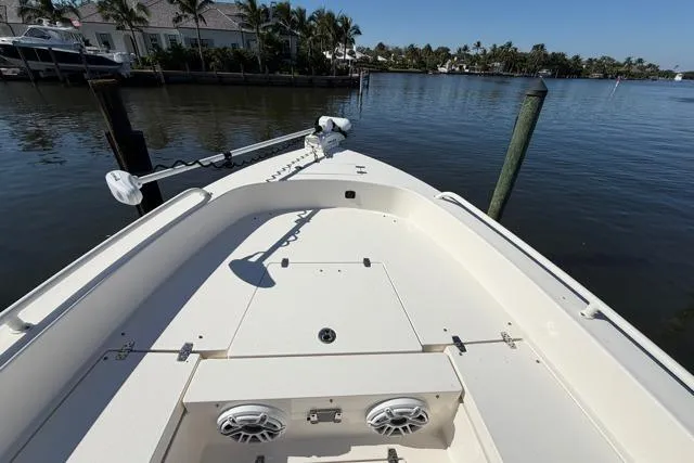  Yacht Photos Pics 2023 Pathfinder 2600 TRS boat docked on calm water with clear sky.