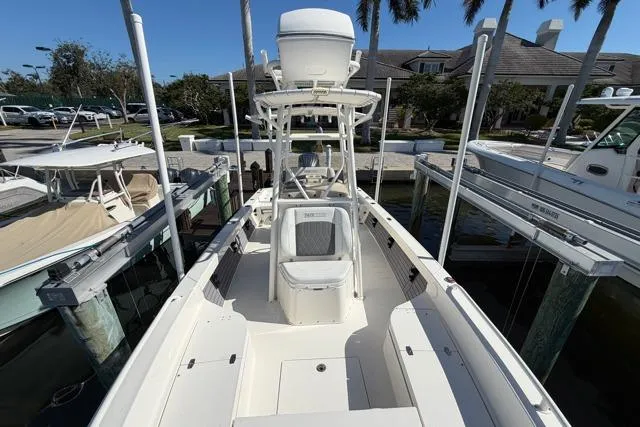  Yacht Photos Pics 2023 Pathfinder 2600 TRS boat docked, featuring spacious deck and modern design.