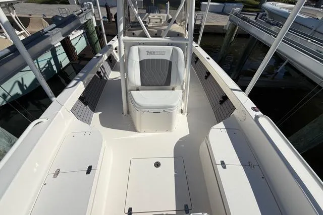  Yacht Photos Pics 2023 Pathfinder 2600 TRS boat interior, featuring seating and storage compartments.