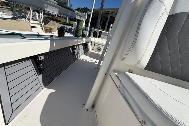  Yacht Photos Pics 2023 Pathfinder 2600 TRS boat interior with sleek seating and storage compartments.