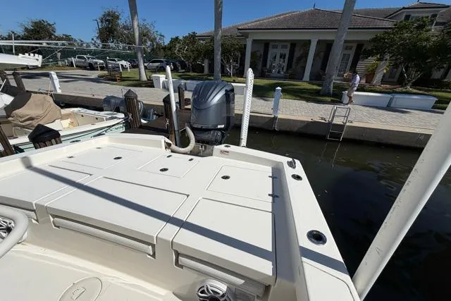  Yacht Photos Pics 2023 Pathfinder 2600 TRS boat docked at marina with outboard motor.