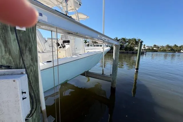  Yacht Photos Pics 2023 Pathfinder 2600 TRS boat docked on a sunny day by the water.