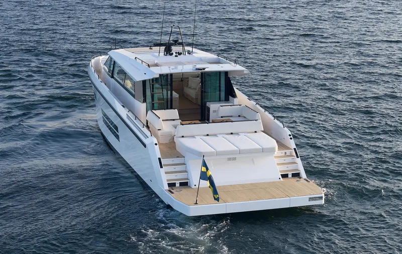  Yacht Photos Pics 2026 Delta Powerboats 72 cruising on open water, showcasing sleek design and luxury features.