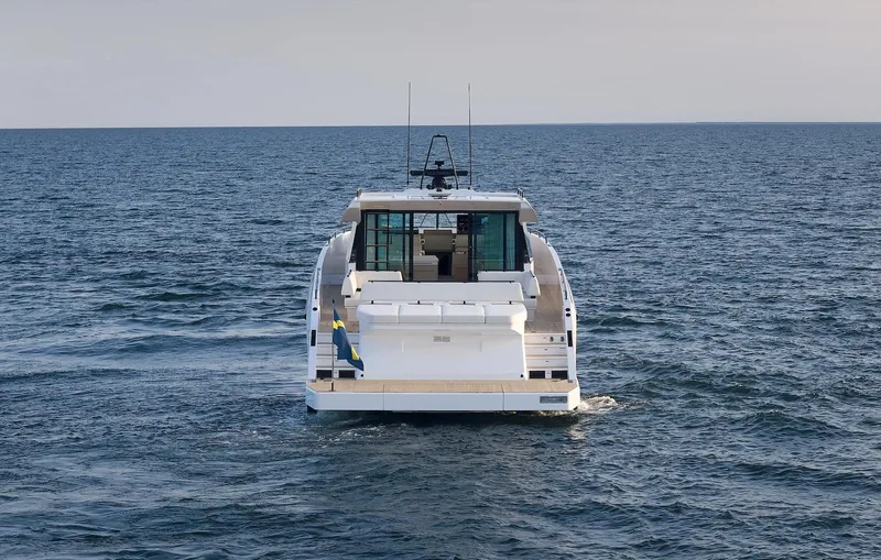  Yacht Photos Pics Delta Powerboats 72 yacht cruising on open sea, rear view, 2026 model.