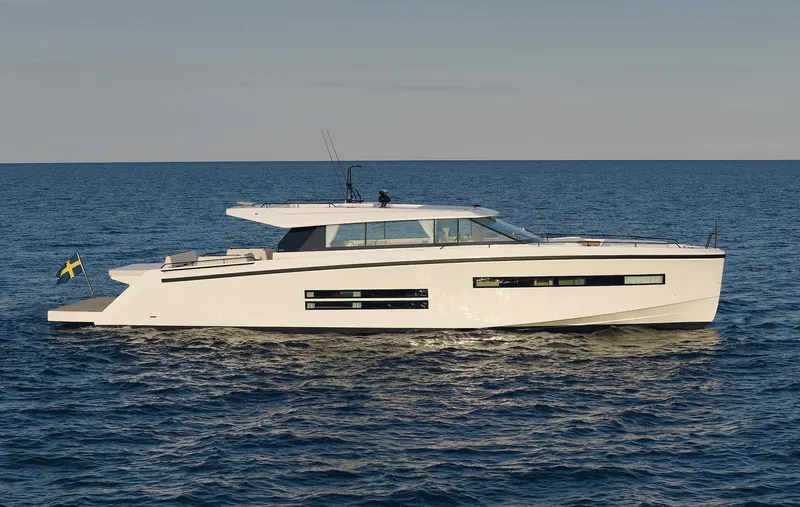  Yacht Photos Pics Delta Powerboats 72 yacht, 2026 model, cruising on open sea with Swedish flag.
