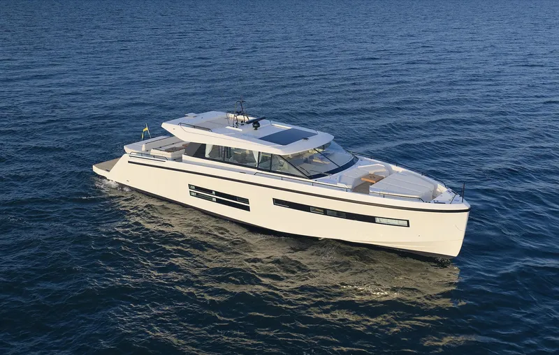  Yacht Photos Pics 2026 Delta Powerboats 72 cruising on open water, showcasing sleek design and modern features.